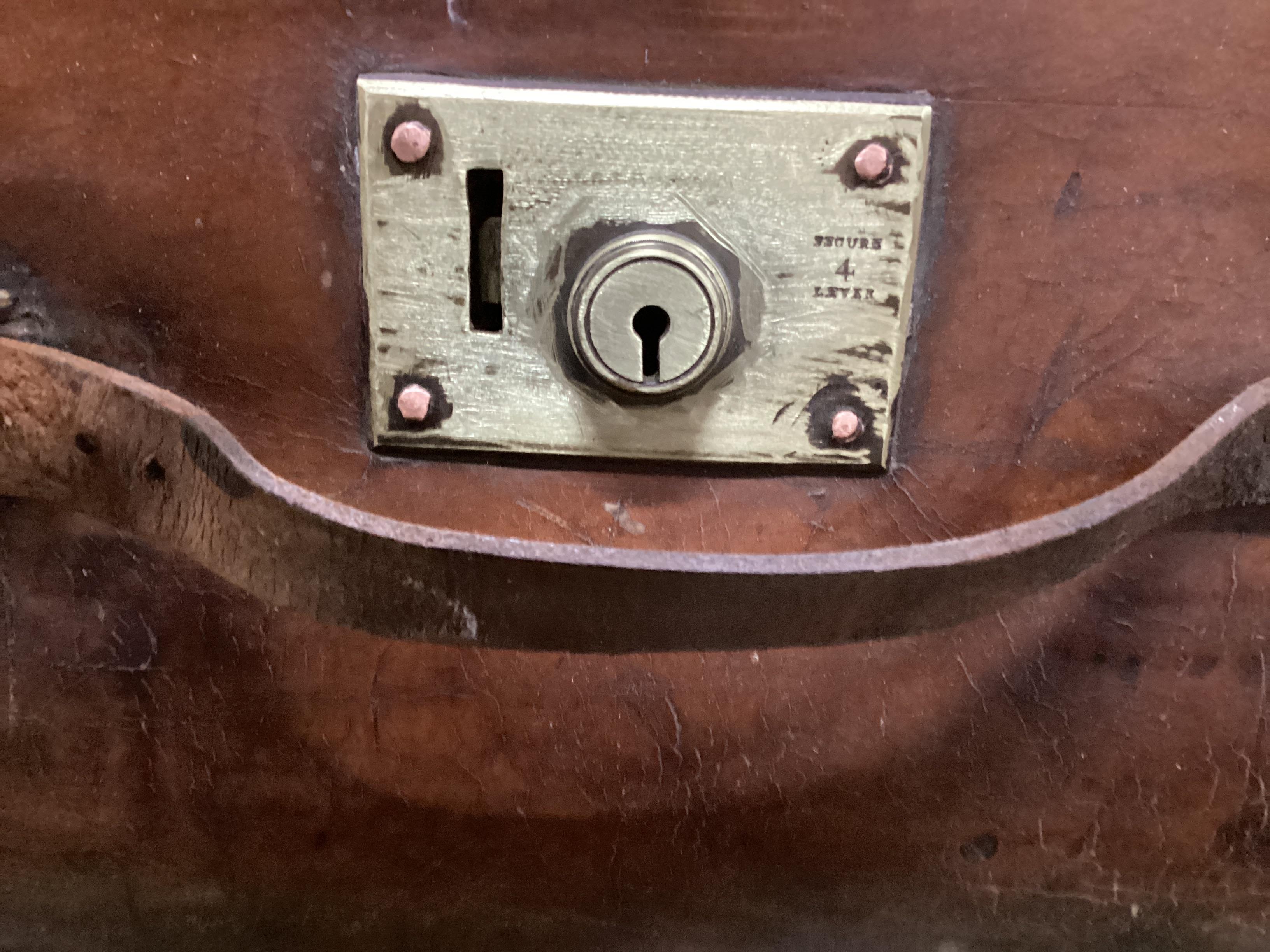 A Victorian leather brass and copper studded travelling trunk, width 86cm, depth 55cm, height 30cm